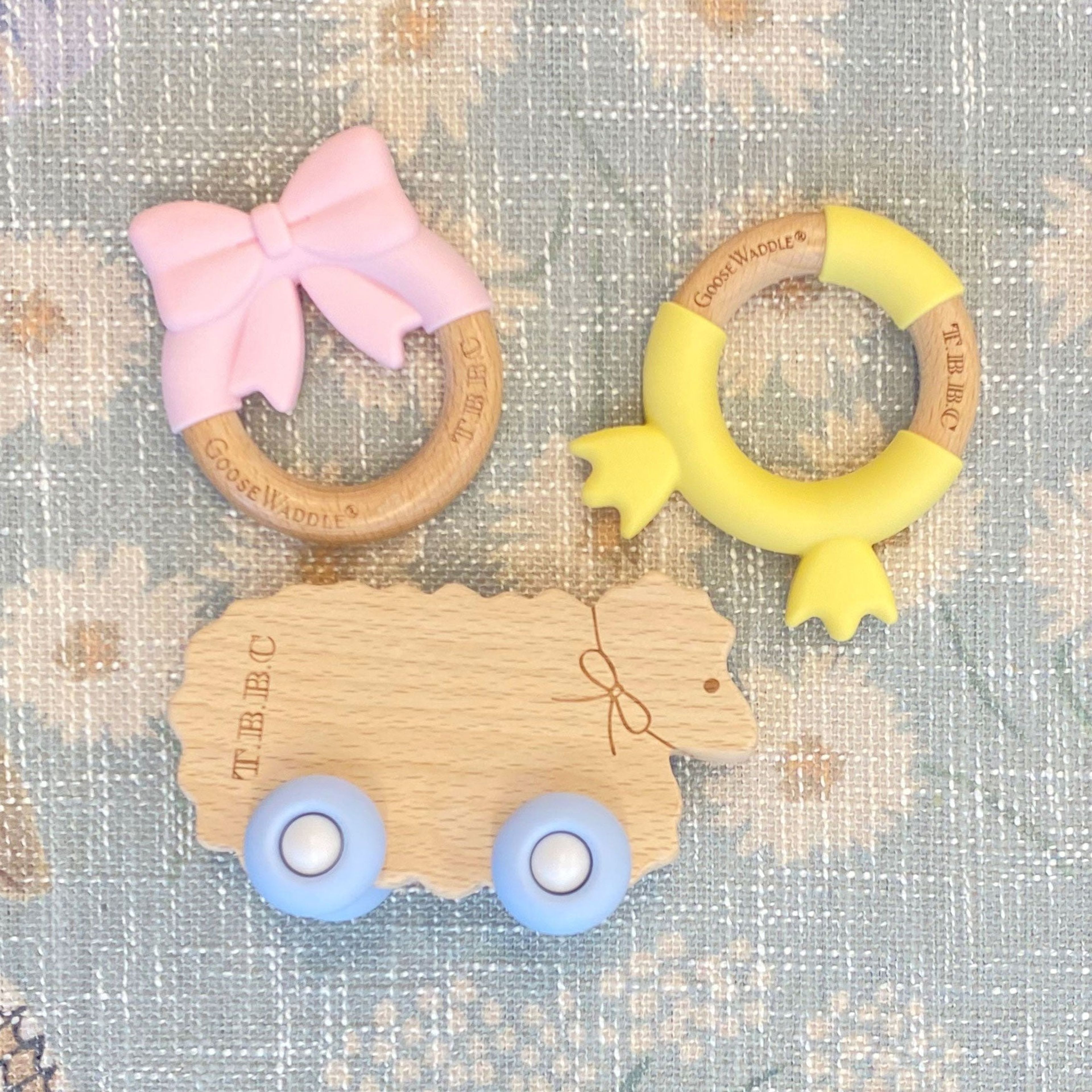 The Beaufort Bonnet Company Sheep with Bow & Blue Wheels Teether