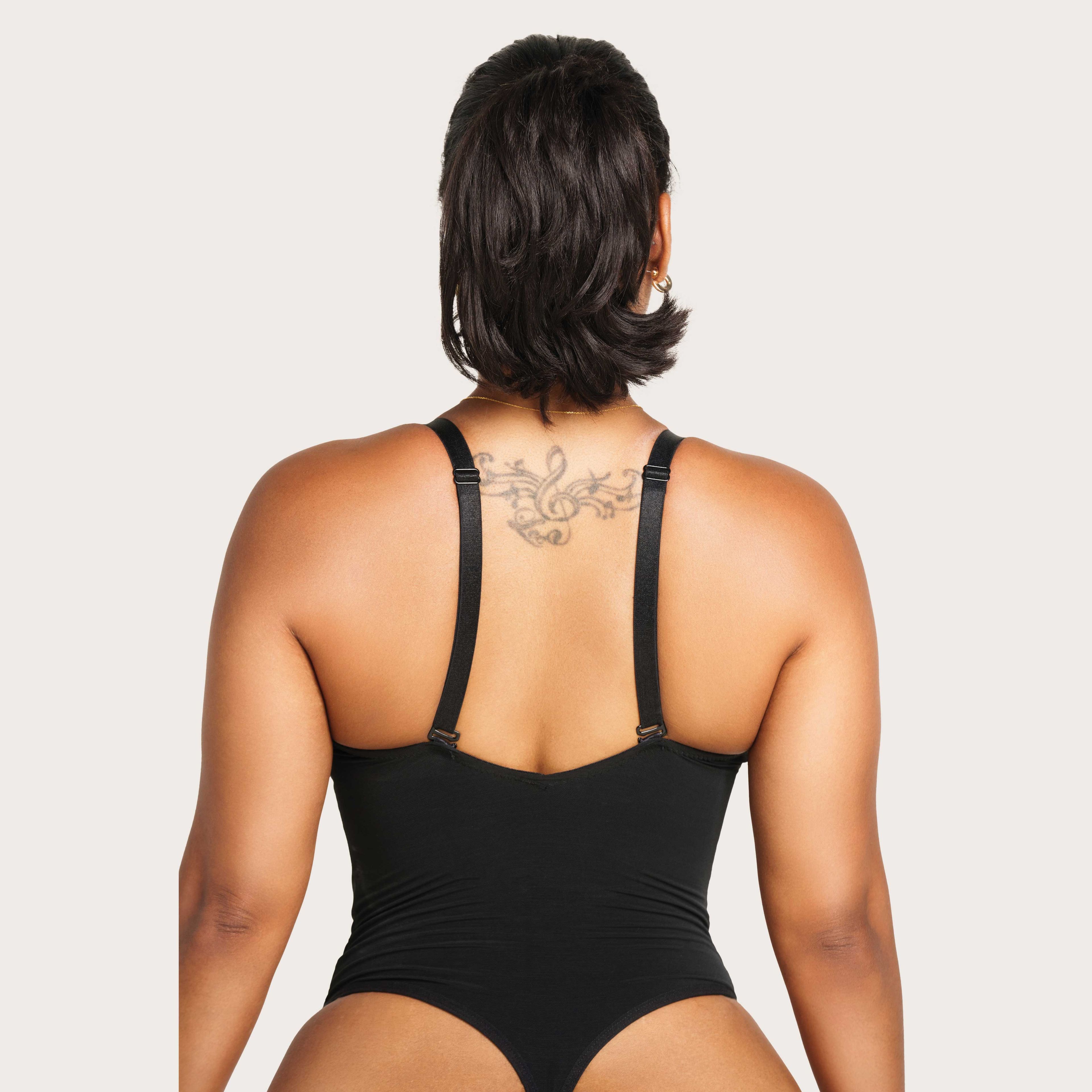 https://cdn.prod.marmalade.co/products/3840x3840/filters:quality(80)/www.jsculptfitness.com%2Fproducts%2Fv-plung-sculpting-bodysuit%2F1665677829%2FCheeky-Body-Suite-3.jpg