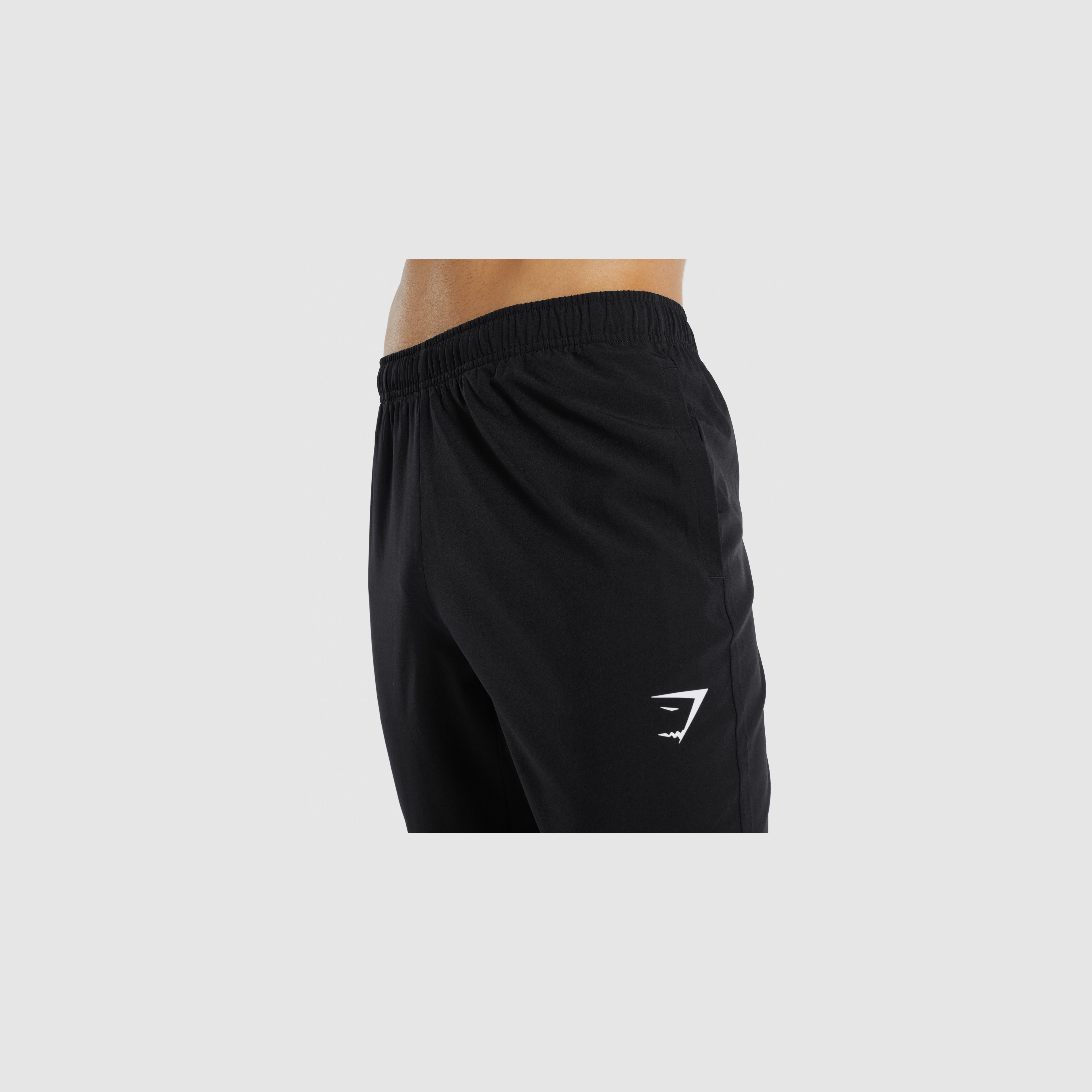 https://cdn.prod.marmalade.co/products/fit-in/3840x3840/filters:quality(80):fill(e6e6e6)/www.gymshark.com%2Fproducts%2Fgymshark-arrival-woven-joggers-black-ss22%2F1644314112%2FARRIVALSLIMWOVENPANT-A1A1X-BBBB-M-AJ3-BLACK.D2-Edit_AS_9d354812-20f7-4bbd-bee3-809dbd0fa1fd.jpg